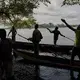 The fisherman of Eala village, led by Patrick Atelo, hunt for a mamba on the river Rukie. Image by Hugh Kinsella Cunningham. Congo, 2019.