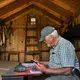 The shed where he records data has been moved back repeatedly because of cliff erosion. Image by John Tlumacki. United States, 2019.