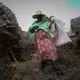 A seaweed farmer carries a life jacket for her boat trip into the deep water. Many women in Zanzibar cannot swim. Image by&nbsp;Haley Joelle Ott. Zanzibar, 2017.