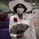 A woman wearing a face mask attends a church service at the New Horizon Church International in Jackson, Miss. Image by Wong Maye-E/AP Photo. United States, 2020.