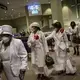 Women wearing face masks leave after a church service at the New Horizon Church International. Image by Wong Maye-E/AP Photo. United States, 2020.