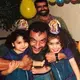 Zahra Ahmad, right, her uncle Mike Mahdi, center, her sister Hawra Ahmad, left, and her father Mohammad Sibte, back, celebrate a birthday. Image courtesy of Ahmad family.