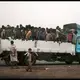 Migrants who arrived by sea are moved by smugglers to a makeshift shelter, called a 'hosh' in Arabic, in Ras al-Ara , Lahj, Yemen, July 23, 2019. Most dream of reaching Saudi Arabia, and earning enough to escape poverty. But even if they reach their destination, there is not guarantee they can stay; the kingdom often expels them. Image by AP Photo / Nariman El-Mofty. Yemen, 2019.