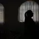 Elisabeth Alvarado stands inside her home in San Jeronimo Xayacatlan, her native town in Mexico, where she stayed behind after her husband Axayacatl Figueroa emigrated to New York in 2005, Friday, June 26, 2020. Their plan was for her to follow and then send for their son, who was 3 at the time, but border agents caught her trying to cross the border five times, and she gave up. Image by Fernando Llano/AP Photo. Mexico, 2020.