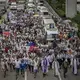 Relatives, friends, and church leaders walk through the funeral procession of Kian Loyd Delos Santos along EDSA Highway in Caloocan, Metro Manila. Image by Eloisa Lopez. Philippines, 2017. 