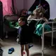 Ahmad Ghalib, 6, and his mother, at Sabaeen Hospital. Image by Alex Potter. Yemen, 2018. 